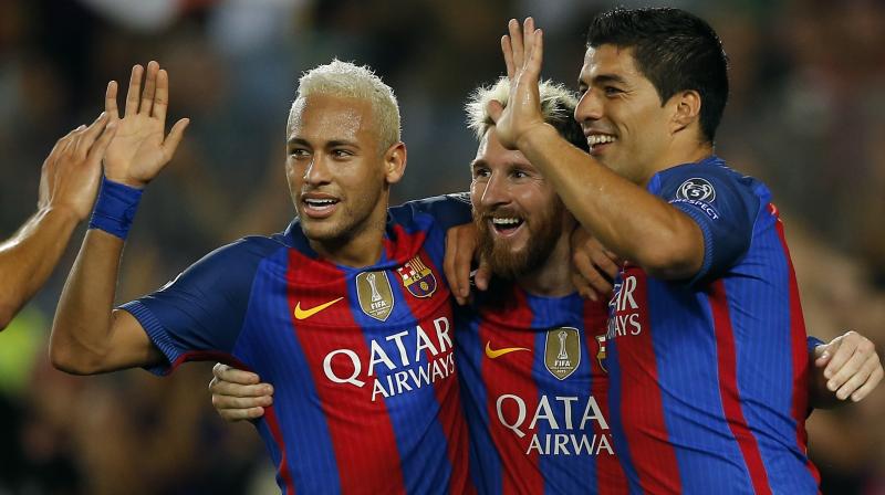 Neymar, Messi y Suárez festejan un tanto en La Liga