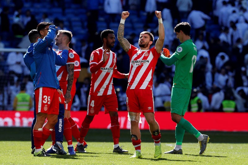 Jugadores del Girona celebran la victoria ante el Real Madrid 