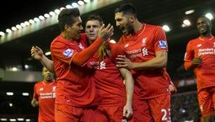 Jugadores del Liverpool celebrando la anotación de Milner