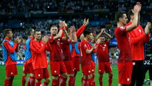 Futbolistas de Polonia tars el partido contra Alemania 