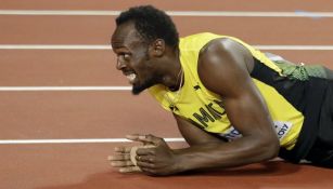 Bolt se lamenta en la pista tras el calambre
