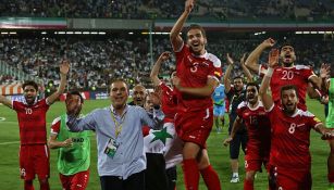 Jugadores de Siria festejan empate contra Irán 