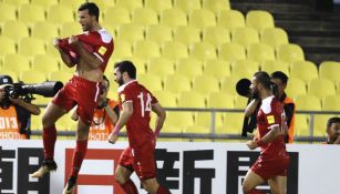 Jugadores de Siria celebran la anotación del empate