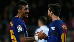 Paulinho y Messi ríen en un partido del Barcelona