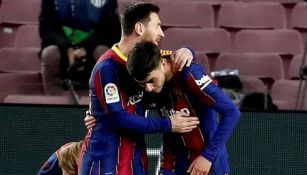 Messi y Pedri en partido con el Barcelona