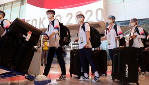 Atletas asiáticos arribando a Tokio 