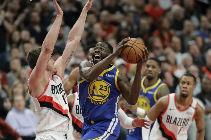 AP Draymond Green intenta superar la marca de Meyers Leonard
