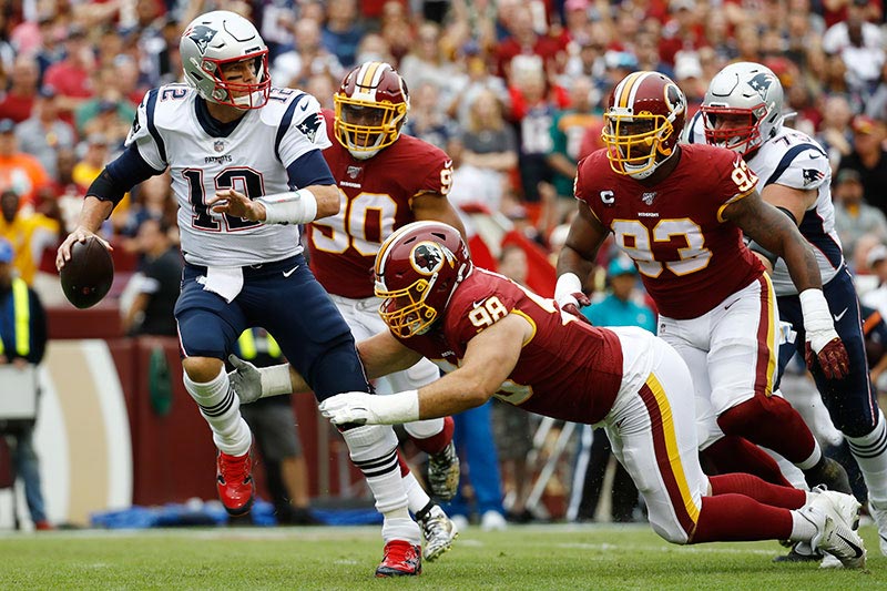 Tom Brady en acción contra los Redskins