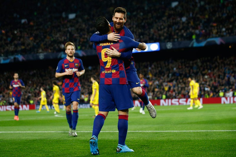 Messi celebra una anotación con Luis Suárez 