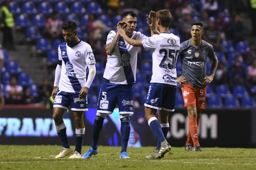 Jugadores del Puebla durante un juego ante el Necaxa