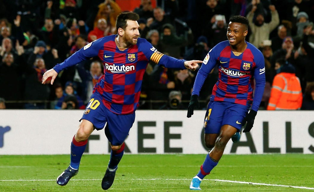Lionel Messi y Ansu Fati celebrando un gol ante Granada
