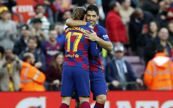 Suárez y Griezmann, durante el partido