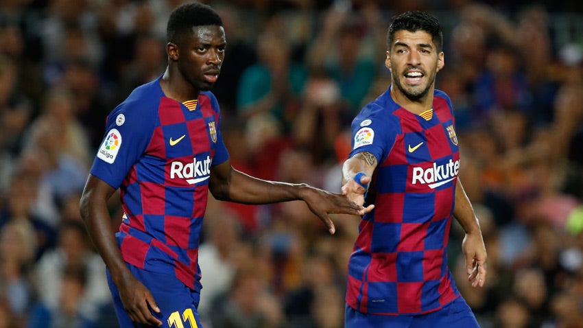 Dembélé y Suárez durante un duelo con el Barcelona 