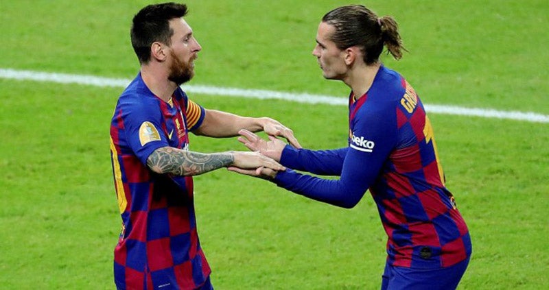 Griezmann y Messi festejan un gol en Barcelona 