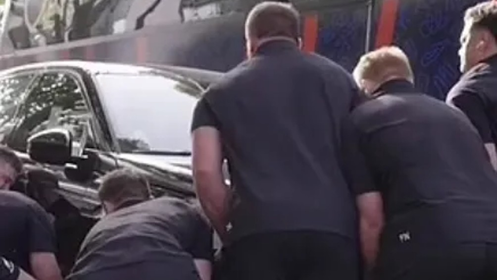 The New Zealand All Blacks lift three-tonne cars to clear a bus lane