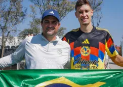 Jardine y Dourado, con la bandera de Brasil
