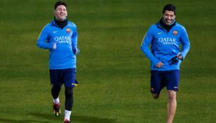 Luis Suárez junto a Lionel Messi durante un entrenamiento del Barcelona