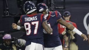 Jugadores de los Texans festejan una anotación