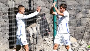 Rodríguez y Giménez celebrando una anotación ante Pachuca