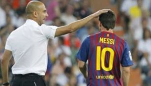 Pep Guardiola junto a Lionel Messi