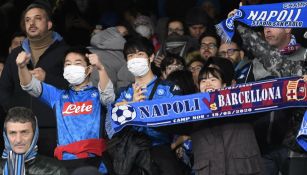 Aficionados en partido de Nápoles vs Barcelona