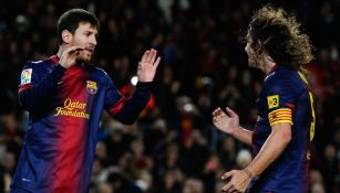 Messi y Puyol celebran gol con Barcelona