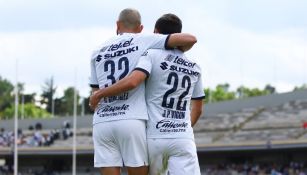 González y Vigón en un partido de Pumas 