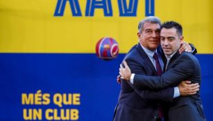 El presidente del Barcelona Joan Laporta y Xavi Hernández 