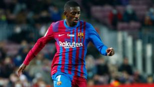 Ousmane Dembélé durante un duelo con el Barcelona 