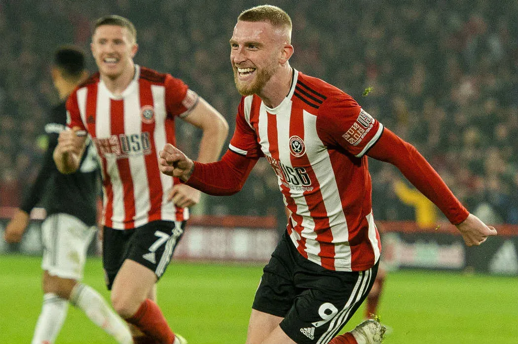Oliver McBurnie celebrando el gol del empate en el tiempo agregado
