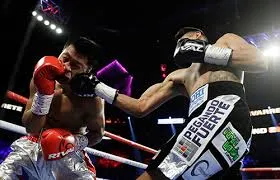 AP Navarrete conecta un golpe contra el filipino Elorde
