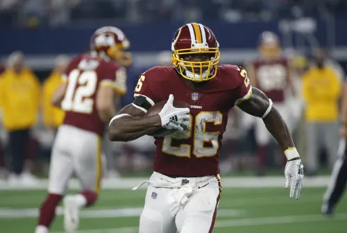 AP Adrian Peterson en un juego de los Redskins