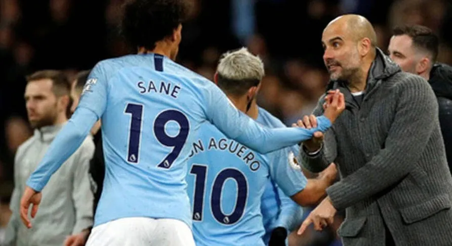 Sané con Guardiola tras un partido