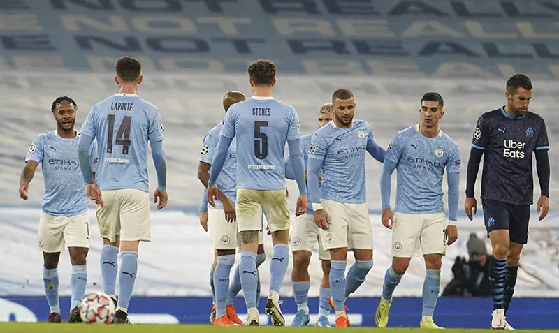 Jugadores del Manchester City celebran un gol en Champions