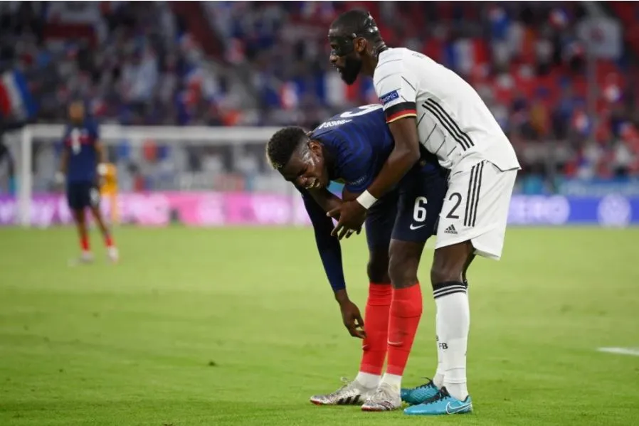 AP Antonio Rudiger y Paul Pogba