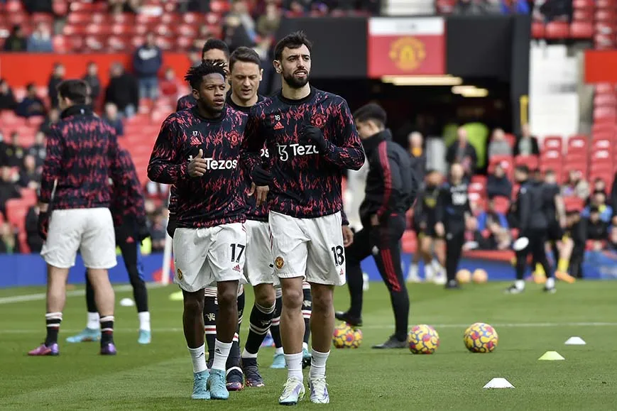 AP Jugadores del ManU previo a un partido de la Premier League