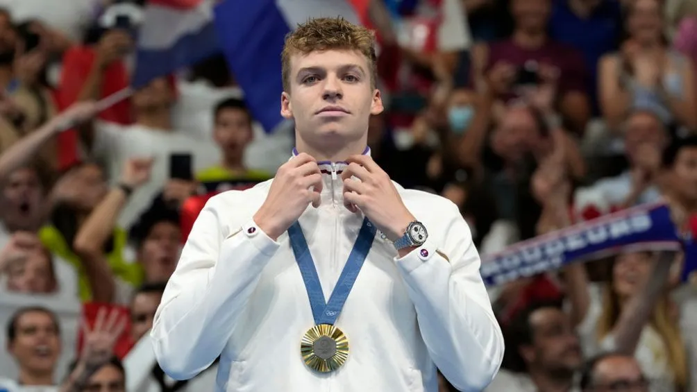 Marchand con medalla de oro