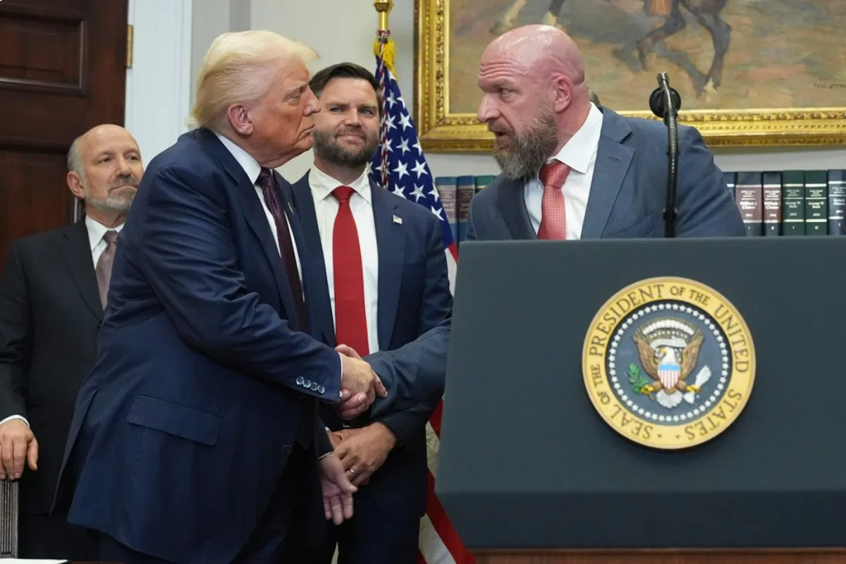 Triple H y Trump | AP