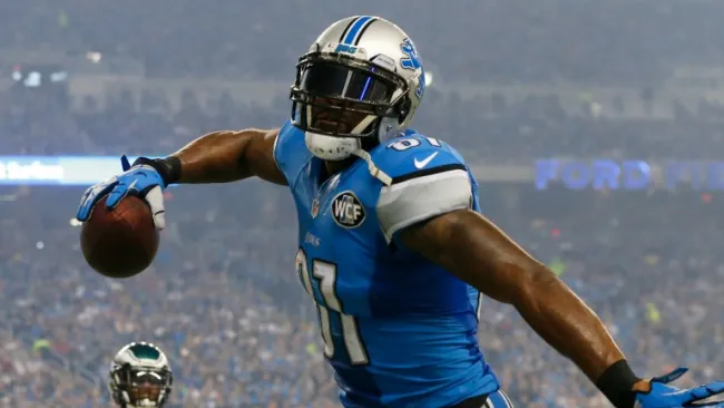Calvin Johnson celebra uno de sus tres touchdowns