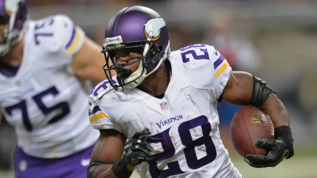 Adrian Peterson en un partido de los Vikingos