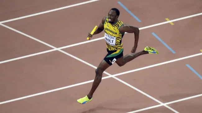 Usain, durante la competencia de 4x100