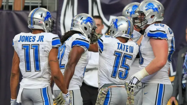Golden Tate celebra con sus compañeros el TD del triunfo
