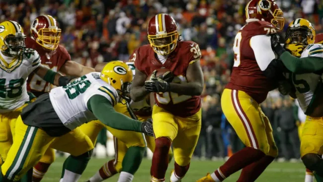 Rob Kelley escapándose con el balón para entrar a la zona de anotación