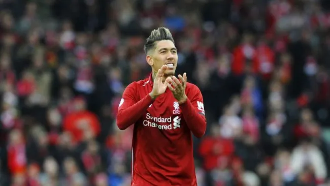 Firmino festeja en un partido de Champions