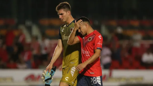 Sebastián Jurado y Jesús Paganoni en lamento, tras partido