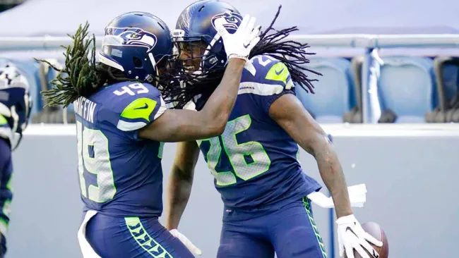 Jugadores de Seattle celebran una jugada contra Dallas