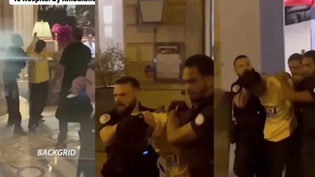 El cantante fue esposado para llevarlo adentro de una patrulla.