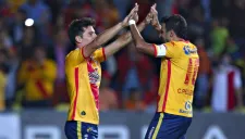 Erpen y Pellerano festejan tras una anotación