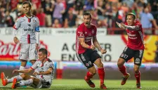 Jugadores de Xolos celebran el gol del triunfo