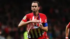 Diego Godín festeja un gol con el Atlético de Madrid
